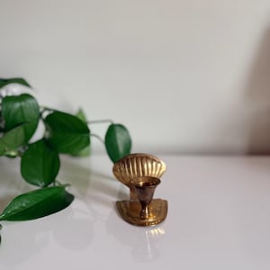 May include: A rustic wooden sign with the text "Welcome to our home" in a handwritten style. The sign features a distressed finish and a simple, inviting design, perfect for entryway decor.