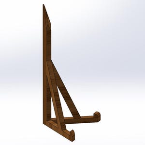 May include: A wooden display stand with a triangular frame and a curved base. The stand is made of brown wood and has a minimalist design. It is suitable for displaying items.