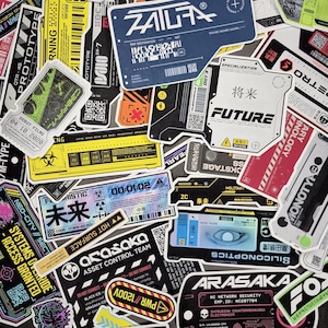 May include: A collection of assorted rectangular and die-cut stickers featuring futuristic, industrial, and cyberpunk-inspired graphic designs. The stickers display various technical labels, barcodes, QR codes, and text including Arasaka, Future, and Prototype in black, white, yellow, blue, and red colour schemes.