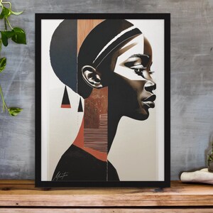 以下が含まれることがあります： 黒、白、赤、茶色の幾何学模様とパターンが施された、横顔の女性の顔の額縁入りプリント。女性は肌の色が濃く、ヘッドバンドをしています。