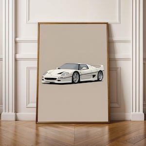 May include: A framed print featuring a white sports car with a sleek design. The car has a low profile, silver wheels, and black accents. The artwork is set against a neutral background, framed in a wooden border, and leans against a wall.