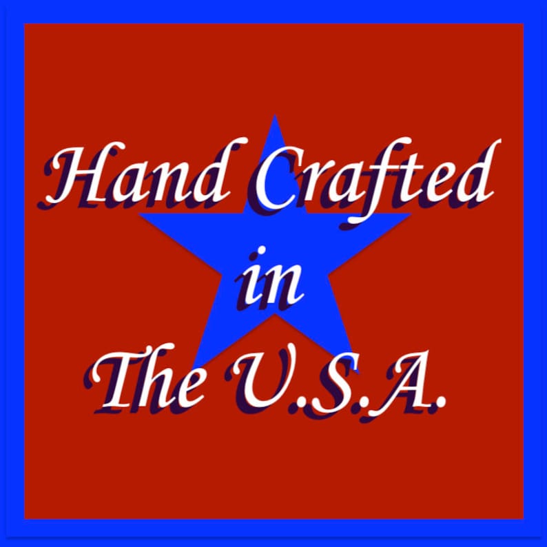 May include: A square graphic with a red background and a blue border. A blue star is in the center, with the words "Hand Crafted in The U.S.A." in white script.