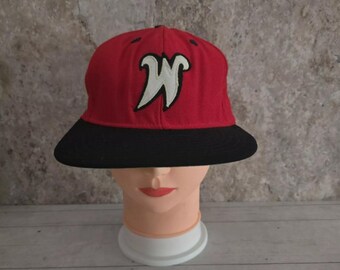 May include: A red and black baseball cap with a white "W" embroidered on the front.