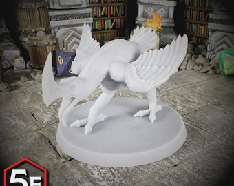 May include: A light gray, 3D-printed miniature of a bird-like creature with large wings and a curved horn. The miniature is on a circular base. The text "5E COMPATIBLE" is in a red and white hexagon.