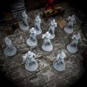 May include: A set of ten gray plastic miniature figures, each with a unique Roman numeral on a circular base. The figures are arranged in a circle on a gray and white tiled surface.