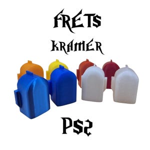 May include: Six guitar fret buttons for a Playstation 2 guitar controller. The buttons are in different colors: orange, yellow, blue, white, red, and white. The buttons are labeled "FRETS KRAMER PS2".