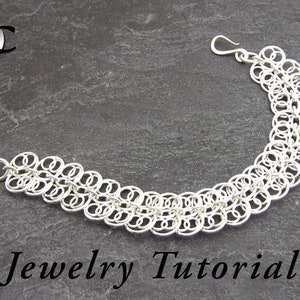 May include: A silver chainmail bracelet with a hook clasp. The bracelet is made of small, interconnected rings arranged in a layered pattern. The words "Jewelry Tutorial" are at the bottom of the image.
