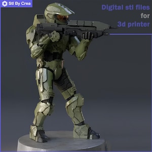 以下が含まれることがあります： ハロービデオゲームシリーズのマスターチーフの3Dプリントモデル。緑と黒で印刷されています。モデルは武器を持っており、戦闘姿勢をとっています。モデルは非常に詳細に印刷されており、塗装の準備ができています。