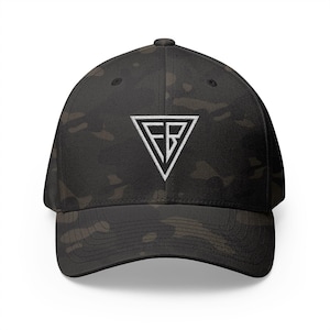May include: A black camouflage baseball cap with a white embroidered logo in a triangle shape. The logo features the letters "FB" inside the triangle. The cap has a curved brim and a structured fit.