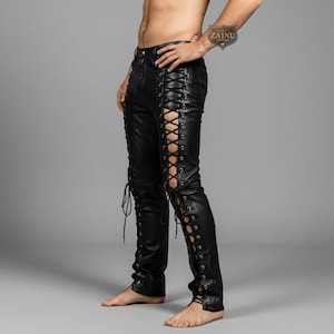 May include: Black leather pants with lace-up detailing along the outer seams. The pants have a fitted silhouette and feature a classic five-pocket design. The lace-up design adds a unique, edgy style to the pants.