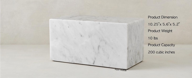 May include: White marble block with a smooth, polished surface. The block measures 10.25 inches by 5.6 inches by 5.2 inches and weighs 10 pounds. It has a capacity of 200 cubic inches.
