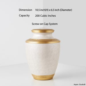 May include: A white urn with gold accents. The urn has a screw-on cap system and measures 10.5 inches high and 6.5 inches in diameter. The capacity is 200 cubic inches. The urn has a decorative floral pattern.