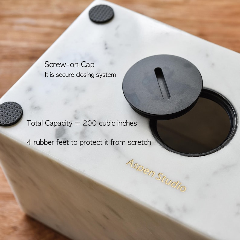 May include: White marble storage box with a black screw-on lid. The box has a capacity of 200 cubic inches and features 4 rubber feet to protect surfaces. The box is labeled "Aspen Studio".