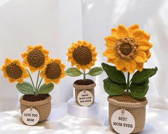 かぎ針編みのピンクと黄色のひまわりの花束、毛糸の花瓶入り。手作りの