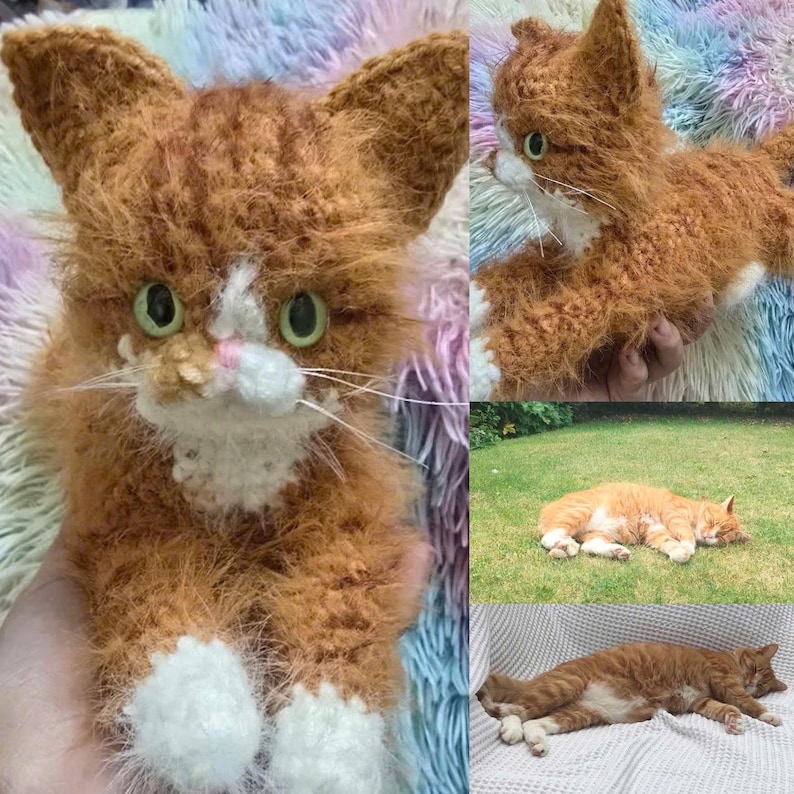May include: A crocheted ginger cat with white markings. The cat is sitting on a fuzzy, multi-colored surface. The cat has a white patch on its chest and white paws.