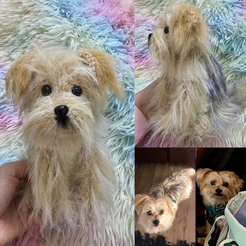 May include: A close-up of a crocheted Yorkshire Terrier dog toy. The toy is light brown with black eyes and a black nose. The toy is sitting on a fluffy pink and blue blanket.