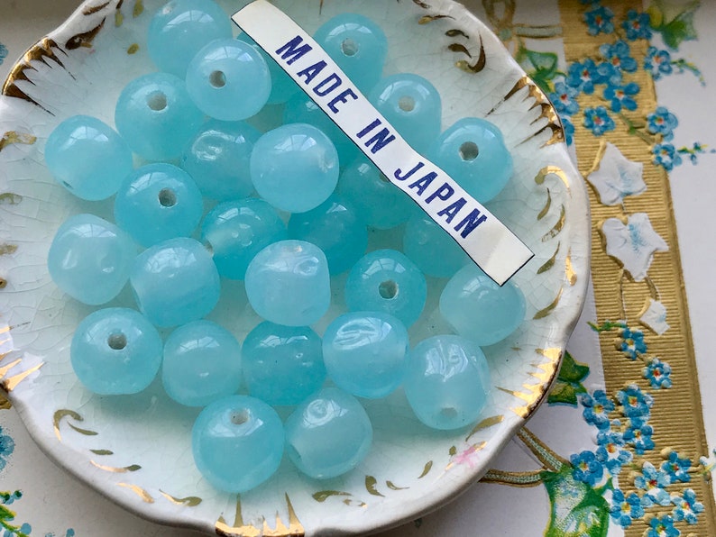 thumbnail interactive-video image 1 of Vintage Cherry Brand Glass Beads – 8mm Sapphire Dimpled, Miriam Haskell Style (20 Beads, #B19) 1 of 3