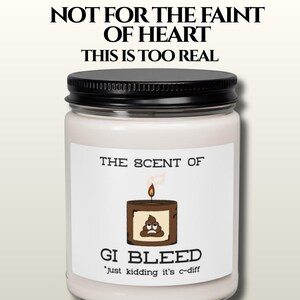 May include: A white candle in a glass jar with a black lid. The label reads "THE SCENT OF GI BLEED" with a graphic of a candle with a poop emoji and the text "just kidding it's c-diff". Above the label is the text "NOT FOR THE FAINT OF HEART THIS IS TOO REAL".