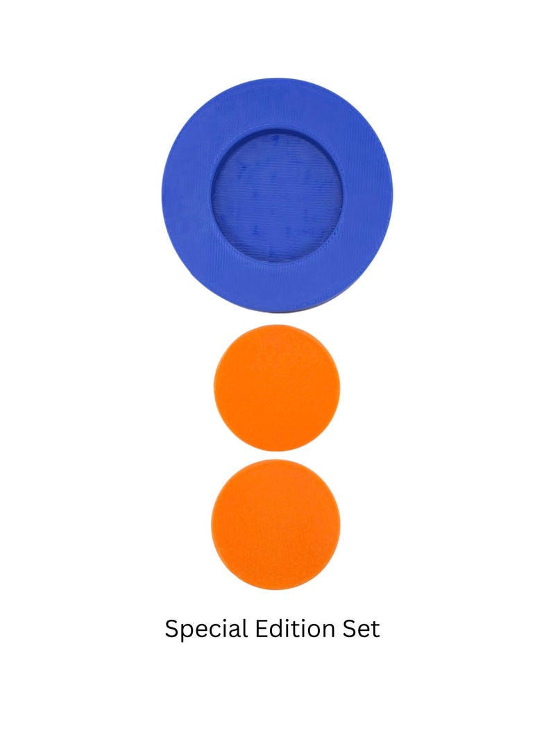 May include: A set of three round coasters. The top coaster is blue with a smaller blue circle in the center. The two bottom coasters are orange.
