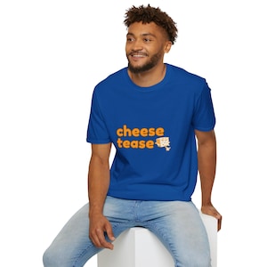 May include: A royal blue t-shirt with the text "cheese tease" in orange letters and a small image of a wedge of cheese.