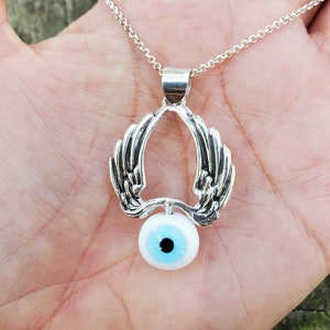 EYEFLY - sterling silver pendant with blue glass eye bead