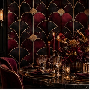May include: A dining room setting featuring wallpaper with a repeating fan-shaped pattern in deep burgundy, black, and gold. The table is set with dark plates, burgundy napkins, crystal glassware, gold candle holders, and a floral centerpiece.