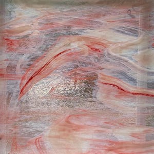 May include: A square sheet of translucent glass featuring a marbled pattern of white and soft red swirls. The surface has a textured, slightly uneven finish with streaks of deep crimson color integrated into the lighter, milky white base.