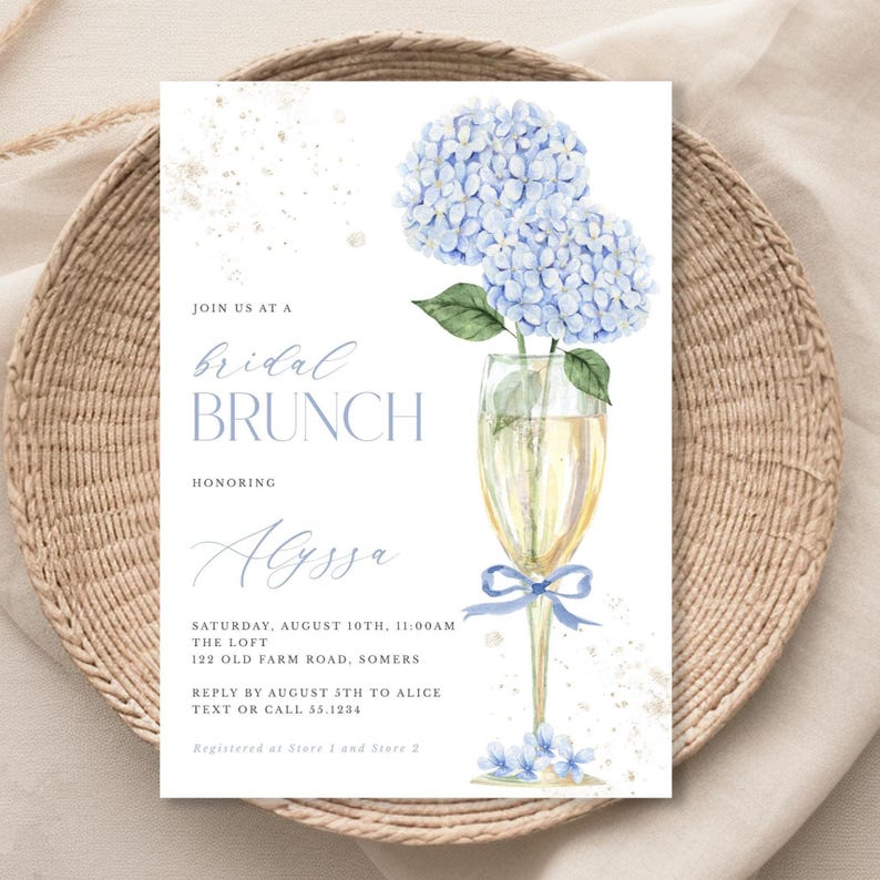 This beautiful design features delicate blue hydrangea flowers, in a gold champagne glass, perfect for your bridal shower or brunch celebration.