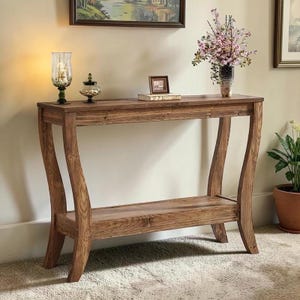 May include: A rectangular wooden console table featuring a rich brown wood grain finish, a flat top surface, and a lower shelf. The table is supported by four curved legs that flare outward, providing a stable base for this furniture piece.