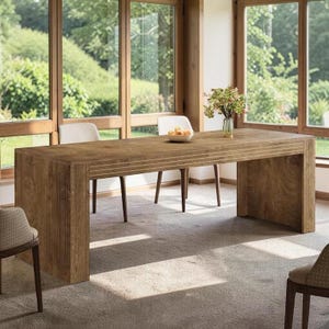 May include: A rectangular wooden dining table with a natural brown finish and vertical fluted detailing on the legs and apron. The table features a smooth top surface and a sturdy, block-style construction, providing a clean and functional design.