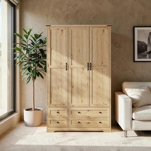 May include: A light wood wardrobe featuring three vertical doors with black handles and four lower drawers with small black knobs. The cabinet has a natural grain finish and a structured rectangular frame, providing storage space for clothing items.