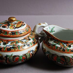 A Canton Porcelain sugar bowl with lid and a milk jar with Hundred Butterflies’ Pattern from 19th century Qing dynasty 晚清广彩百蝶纹糖罐和奶罐