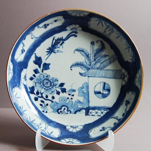 A Chinese blue and white big dish from 18th century, early Qing period with motif of phoenix pursuing the partner 凤求凰