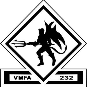 May include: Black and white emblem featuring a devil figure with a trident, wings, and a tail, inside a diamond shape. The text "VMFA 232" is displayed below the diamond. The design is a silhouette.