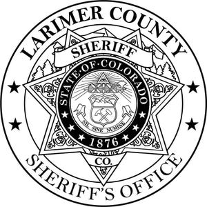 May include: A black and white emblem for the Larimer County Sheriff's Office. The circular design includes text, a star, and a central seal with the words "State of Colorado" and "Nil Sine Numine".
