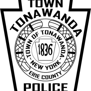 May include: Black and white illustration of a police badge with the text "Town of Tonawanda, Erie County, New York, 1836" and "Police" in a bold font.