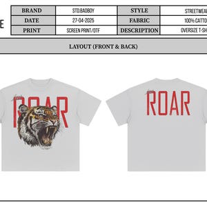May include: Oversized white t-shirt with a roaring tiger graphic. The front features a detailed tiger head with the word "ROAR" in red block letters. The back of the shirt also displays "ROAR" in red. Made of 100% cotton.