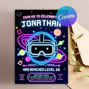 May include: A neon-style invitation with a black background, featuring a virtual reality headset, planets, and stars. The text reads "JOIN US TO CELEBRATE JONATHAN HAS REACHED LEVEL 10". Additional details include the date, time, and location.