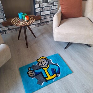 May include: A blue rug with a cartoon character on it. The character is a man with yellow hair, a blue jumpsuit, and a yellow undershirt. He is giving a thumbs up. The rug is on a wooden floor.