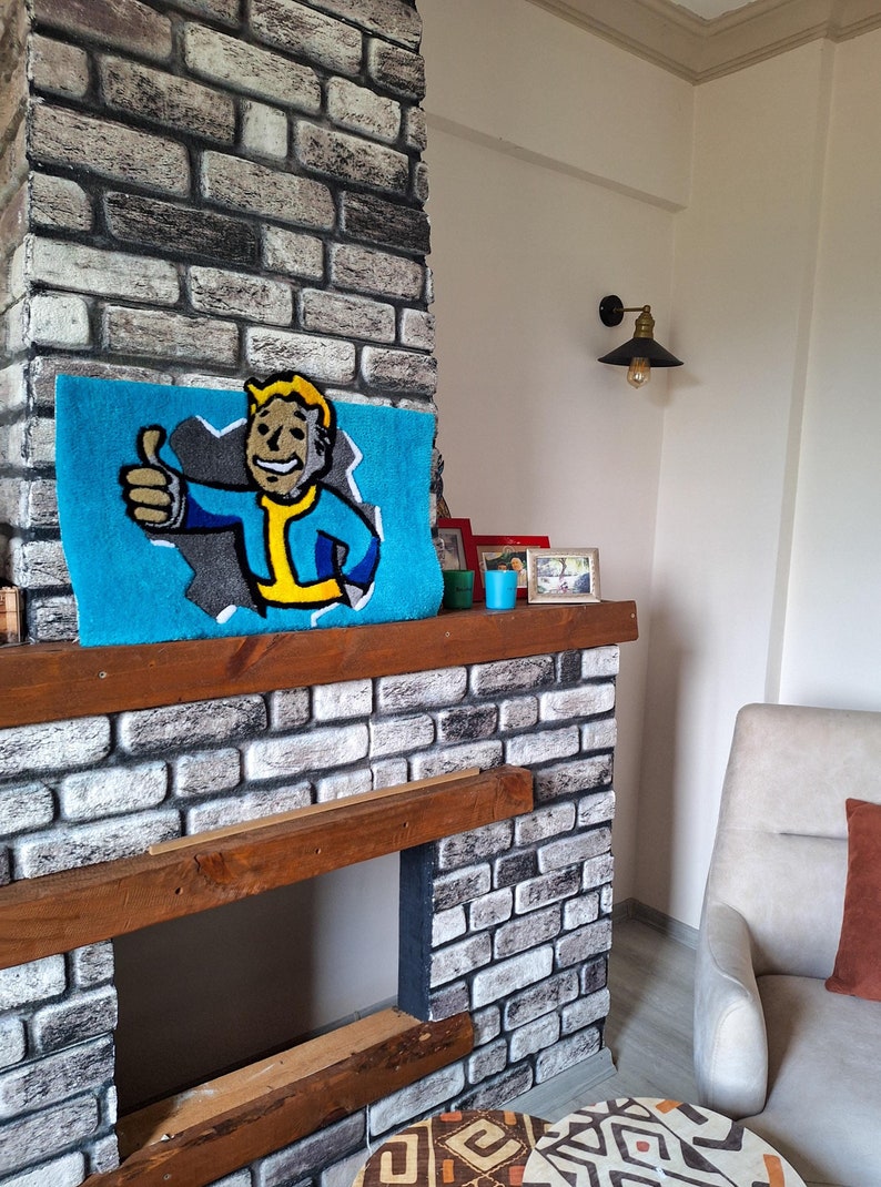 May include: A brick fireplace with a wooden mantel and a blue rug with a cartoon character on it. The rug features a character with a yellow jumpsuit and a blue shirt giving a thumbs up. There are small framed pictures on the mantel.