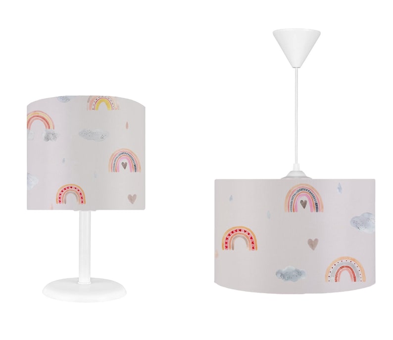 May include: Two white pendant lights with a grey fabric shade featuring a rainbow and heart pattern.