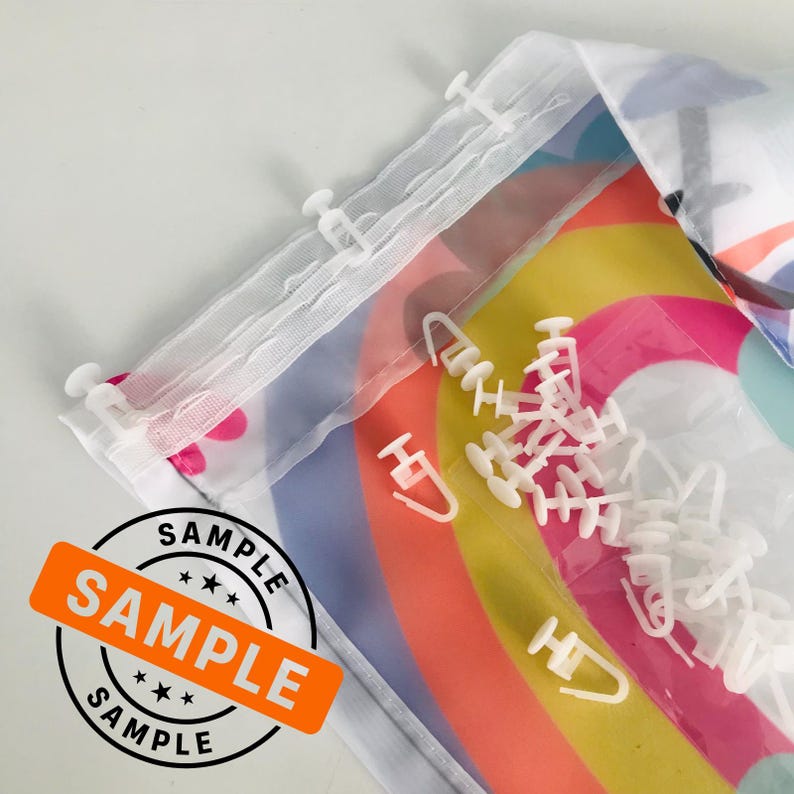May include: White plastic curtain clips with a rainbow patterned fabric behind them. The fabric has the word "SAMPLE" printed on it.