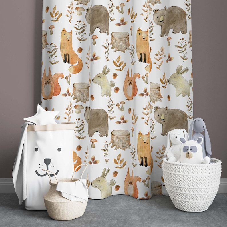 May include: White curtain with a repeating pattern of woodland animals, including foxes, squirrels, bears, and rabbits. The animals are illustrated in watercolor style with brown, orange, and beige colors. The background is white with brown leaves and mushrooms.