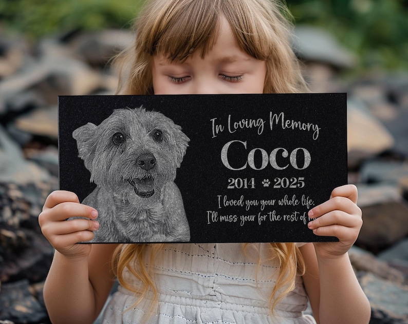 May include: Black granite pet memorial with a photo of a dog and the text "In Loving Memory Coco 2014 2025 I loved you your whole life. I'll miss you for the rest of"