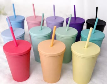 May include: A set of three ceramic mugs with a speckled, matte finish. The mugs are in shades of cream, light gray, and dark gray. Each mug has a simple, minimalist design, perfect for coffee or tea.