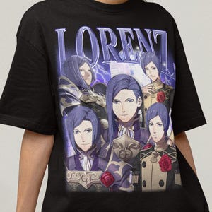 May include: Black t-shirt featuring a graphic of a character named "LORENTZ" with multiple images of the character in various poses. The design has a vintage aesthetic with a purple and blue color scheme.