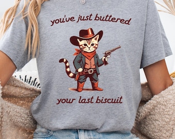 Funny Cowboy Cat T-Shirt: You've Just Buttered Your Last Biscuit