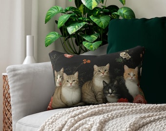 May include: A throw pillow with a black background featuring a group of five cats with floral accents. The cats are arranged in a row, with the largest cat in the center. The cats are all looking at the viewer. The pillow is made of a soft, comfortable fabric.