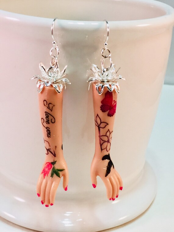 barbie arm earrings