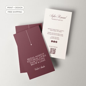May include: Two rectangular business cards featuring a deep burgundy and off-white colour scheme. One card displays contact details for Sofia Renard, a makeup artist, including a QR code. The other card lists services like bridal makeup and hair styling.